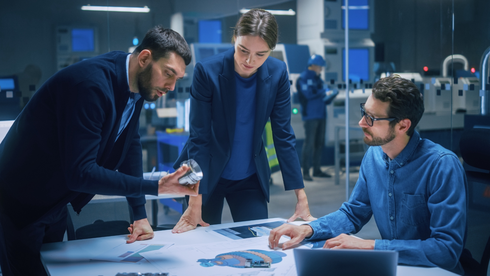 Assurance specialists examining parts